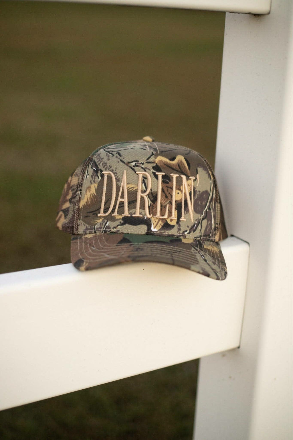 western camouflage trucker cap featuring raised neutral toned "Darlin" lettering 