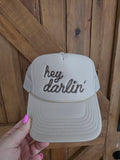 Cream five panel mesh back trucker cap with brown Hey Darlin embroidered front detailing
