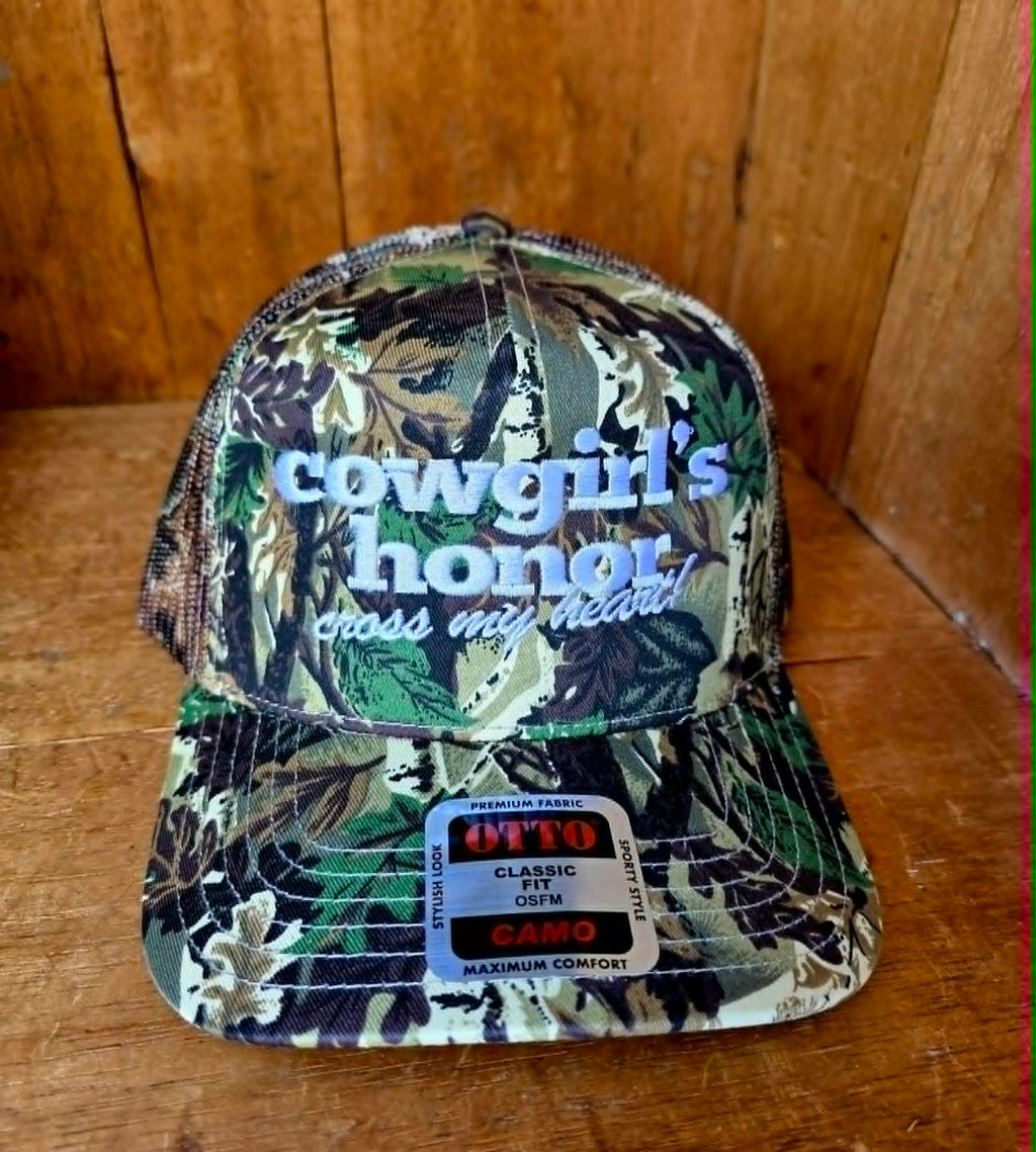 Western camouflage trucker cap featuring bold white embroidered lettering, curved brim, breathable mesh back, and vintage country styling for the ultimate cowgirl look 