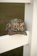 Camo full trucker cap with oversized gold "DARLIN" embroidery across the front