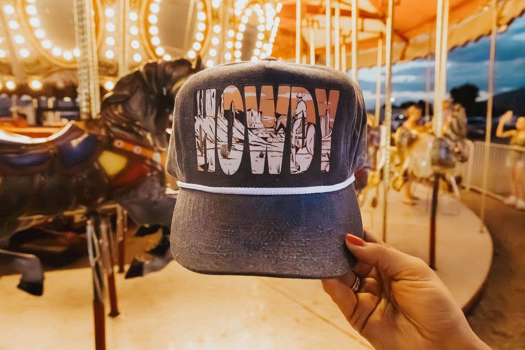 Grey stone trucker cap with bold howdy desert cowboy graphic and white rope detail,