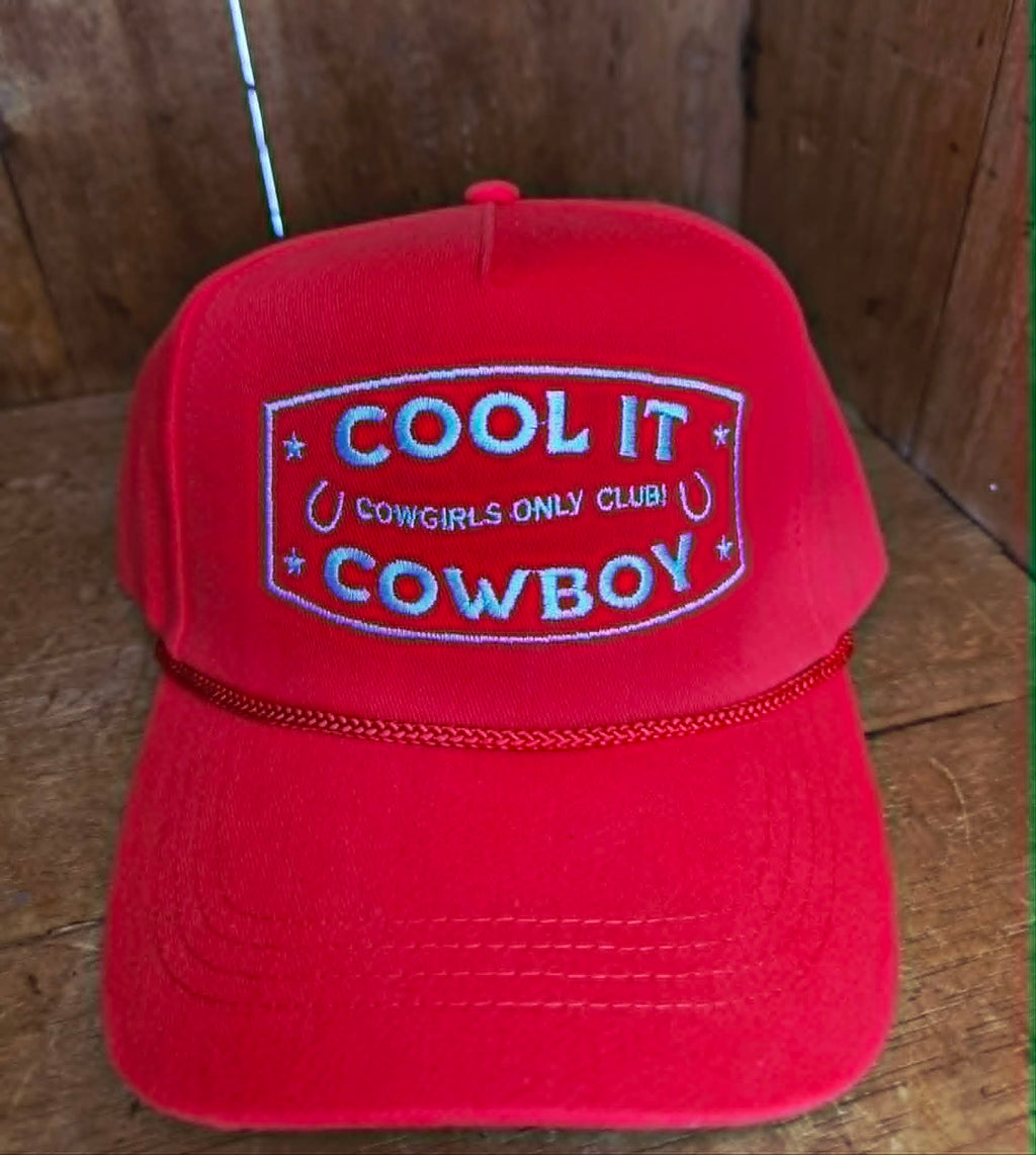 Red cowgirl inspired trucker cap with structured front panel, white embroidered western slogan, and classic rope detail across the brim, perfect for country music festivals and rodeo outfits