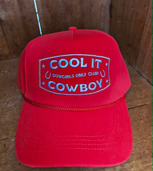 Red cowgirl inspired trucker cap with structured front panel, white embroidered western slogan, and classic rope detail across the brim, perfect for country music festivals and rodeo outfits